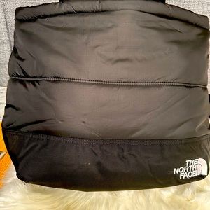 North face shoulder tote bag with laptop compartment and interior pockets.